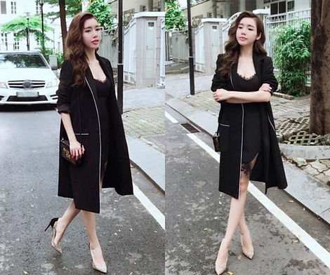 Kết hợp đầm ren đen và áo khoác dáng dài tiệp màu, Elly Trần không chỉ khoe được vẻ gợi cảm một cách chừng mực mà còn thể hiện gu thời trang tuyệt mỹ, bắt nhịp xu hướng.
