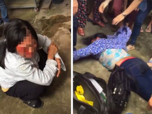 Ảnh cắt từ clip hai người phụ nữ bị đánh dã man vì nghi bắt cóc trẻ em ở Sóc Sơn.