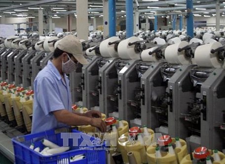 Sản xuất sợi xuất khẩu của Công ty Cổ phần Sợi Phú Bài - Huế. Ảnh: Quốc Việt/TTXVN