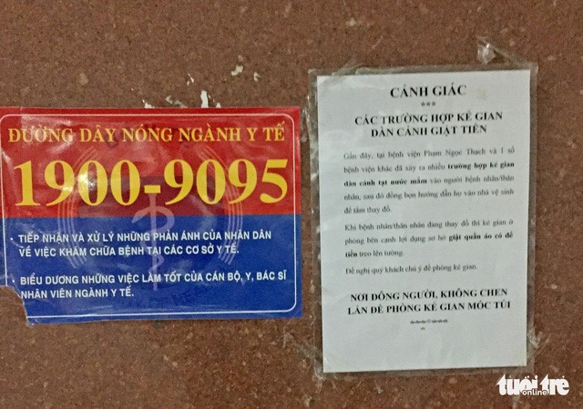 Một cảnh báo được dán bên trong Bệnh viện Phạm Ngọc Thạch - Ảnh: TẤN PHÁT