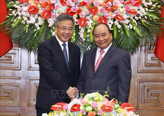 Thủ tướng Nguyễn Xuân Phúc (bên phải) và Phó Thủ tướng Quốc vụ viện Trung Quốc Hồ Xuân Hoa. Ảnh: Thống Nhất/TTXVN