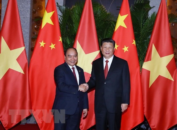 Thủ tướng Nguyễn Xuân Phúc hội kiến Tổng Bí thư, Chủ tịch Trung Quốc Tập Cận Bình. (Ảnh: Thống Nhất/TTXVN)