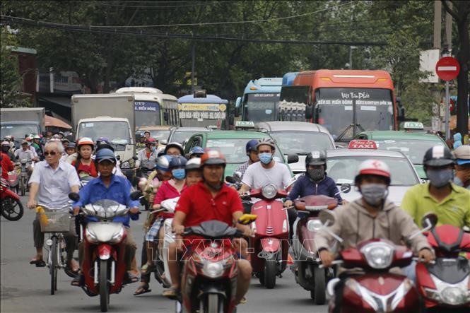 Trước cổng bến xe miền Đông (TP Hồ Chí Minh) luôn quá tải các phương tiện tham gia giao thông trong dịp Tết. Anh: Hoàng Hải/TTXVN