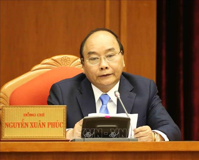 Thủ tướng Chính phủ Nguyễn Xuân Phúc trình bày Báo cáo tiếp thu, giải trình ý kiến của Trung ương. Ảnh: Phương Hoa/TTXVN