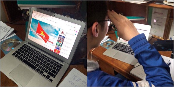 Một học sinh Trường THCS & THPT Nguyễn Tất Thành (Hà Nội) hát quốc ca và chào cờ trực tuyến - Ảnh: Phụ huynh cung cấp