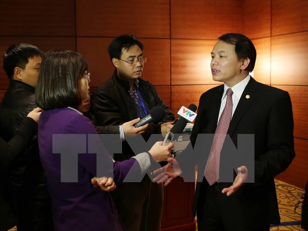 Phó Chánh văn phòng Trung ương Đảng Lê Quang Vĩnh trả lời phỏng vấn báo chí chiều 24/1. (Nguồn: TTXVN)