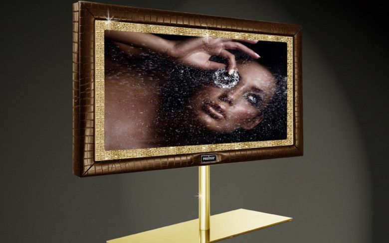 Stuart Hughes Prestige HD Supreme Edition (1,5 triệu USD) có kích thước 55 inch và độ phân giải HD. Chiếc TV này cón được dát 19 kg vàng 22K và khung viền được đính thêm 48 viên kim cương