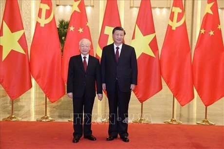 Tổng Bí thư Nguyễn Phú Trọng và Tổng Bí thư, Chủ tịch Trung Quốc Tập Cận Bình chụp ảnh chung. (Ảnh: Trí Dũng-TTXVN)